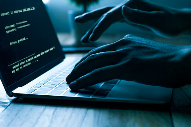 hacker on laptop